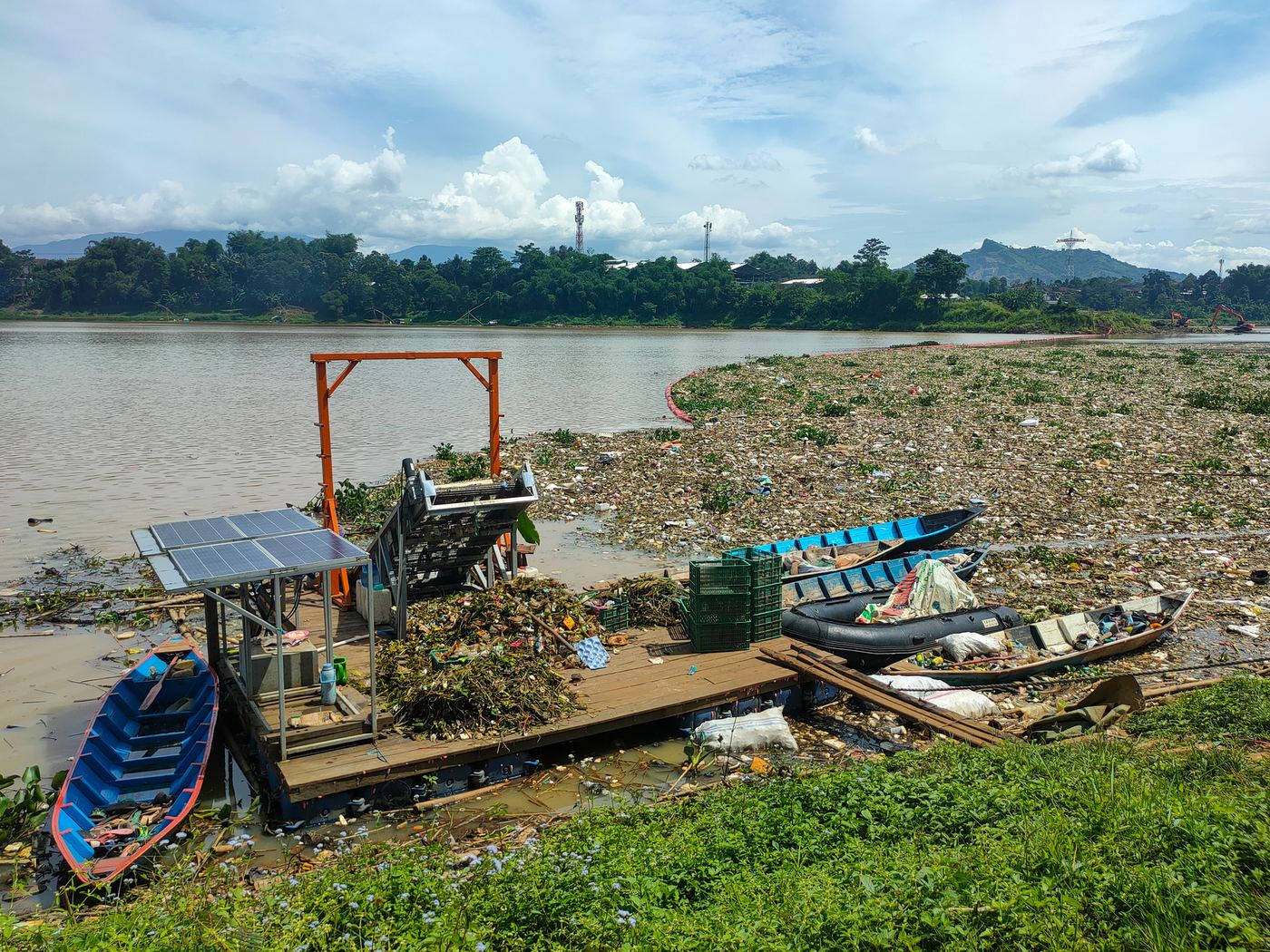Solar-powered interception platform and boats on the Citarum River