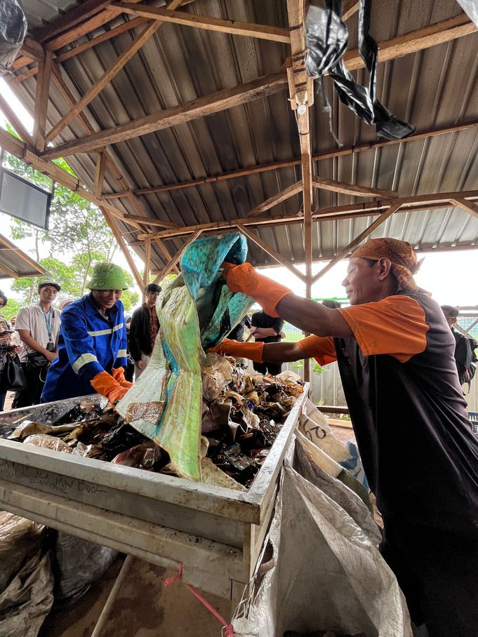 Workers unloading recovered waste in Bandung