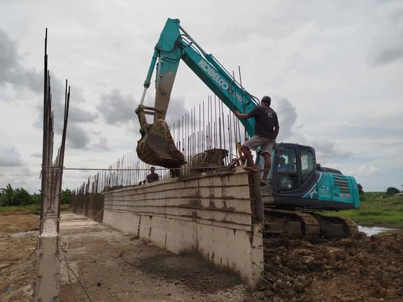 Construction formwork next to an excavator